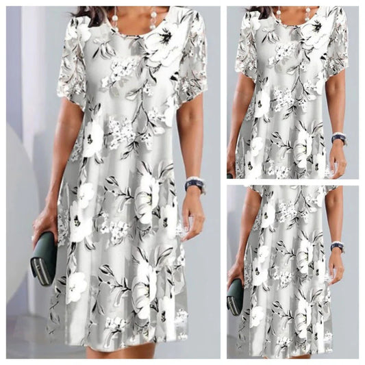 Elegantné šaty s okrúhlym výstrihom a voľnou kvetinovou potlačou s krátkymi rukávmi